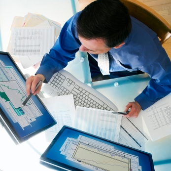 man with two computer screens.JPG